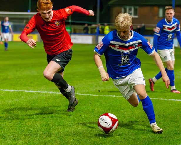 Max Howells has extended his loan at Whitby Town.
