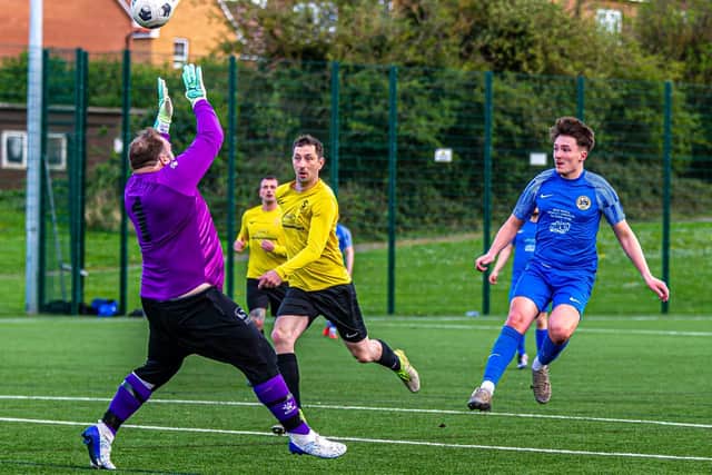 Koby Little lobs the Boro keeper to open the scoring for Whitby Fishermen's Society Development. Photo by Brian Murfield