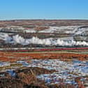 A steam train on the snow-covered North York Moors. picture: John Hunt.