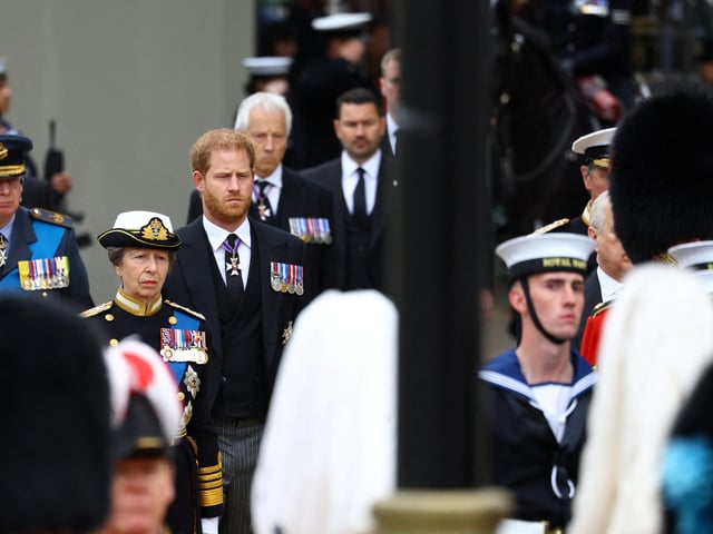 Princess Anne, Princess Royal, Prince Harry, Duke of Sussex and Prince Richard, Duke of Gloucester stand behind the coffin as they take part in the state funeral and burial of Queen Elizabeth II at Westminster Abbey. (Photo by Hannah McKay- WPA Pool/Getty Images)