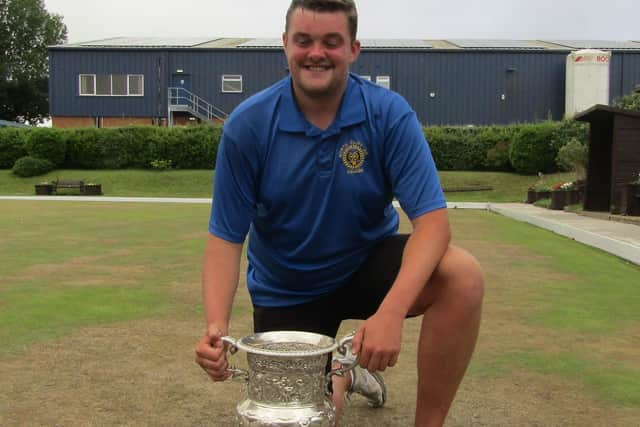 Callum Malone holds the William Boyes Cup.