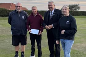 Kevin Gates, left, and Gareth Gidman are presented with their prizes by representatives of sponsors Ernest Brigham's Undertakers after winning the Bridlington Bay Open Doubles Merit
