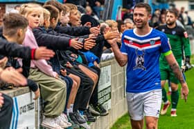 Whitby Town's Dan Rowe celebrates with the home fans after their FA Cup win against Morpeth Town. PHOTO BY BRIAN MURFIELD