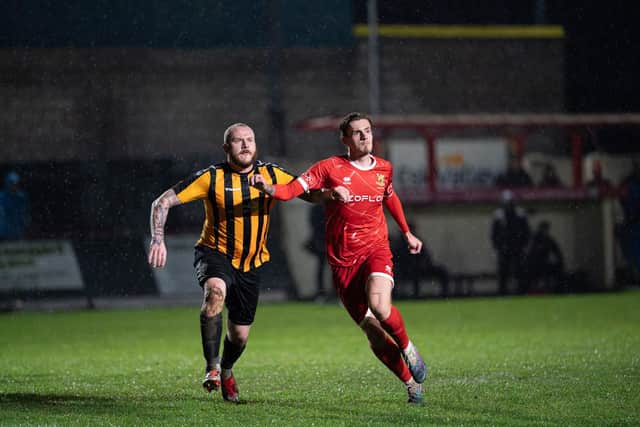 Bridlington Town, red kit, battle it out with Brandesburton in the East Riding FA Senior Cup. Photo by Wandering Photography