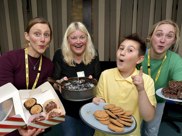 Cakes galore at the Coffee afternoon - volunteers Anna Blower, Kathryn Benson, Mel Isacc and a pupil are ready to serve cakes!
