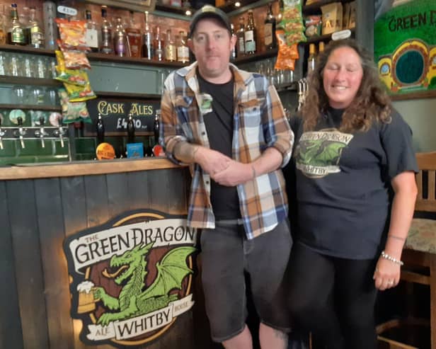 Chris Hodgkinson, owner, and Ally Brisby at the bar of the Green Dragon.