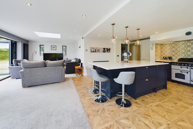 The kitchen and diner with easy seating area.