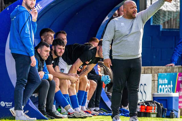 Nathan Haslam in the Whitby Town dugout.