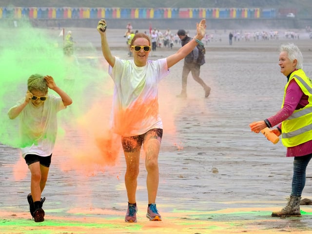 Completing the race in a sea of colour.