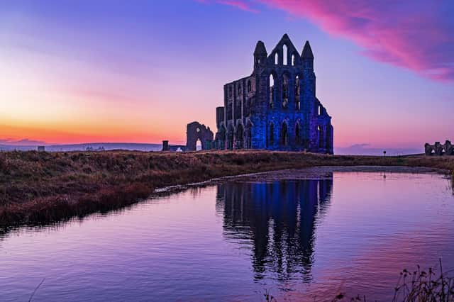 The sun sets as the Illumination of Whitby Abbey starts which runs over Halloween half term week.