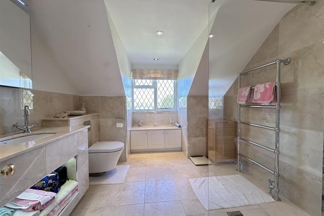 A stylish bathroom with walk in shower.