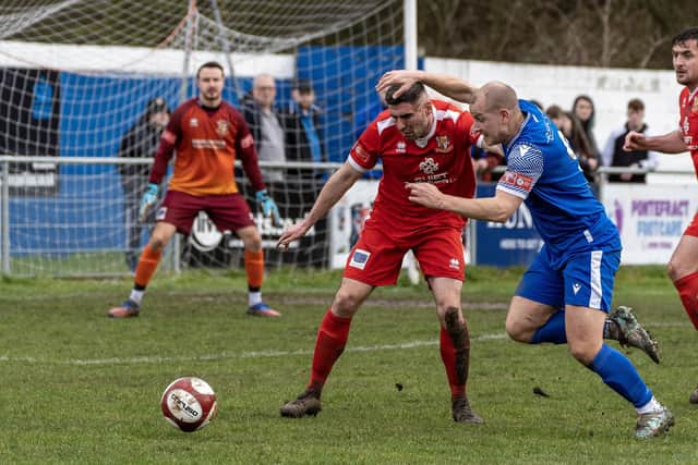 Brid defender James Williamson battles for the ball.