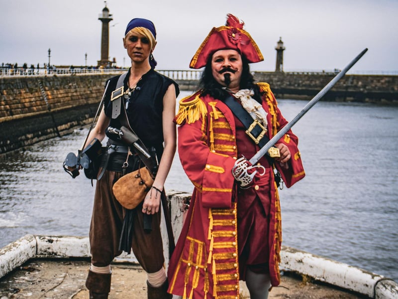 Pirates dressed to impress - complete with swords.
