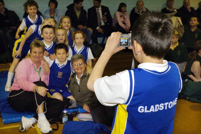 A Gladstone Road team member captures a group picture for posterity at the indoor athletics.
084960e