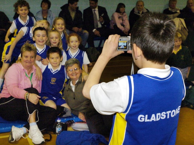 A Gladstone Road team member captures a group picture for posterity at the indoor athletics.
084960e