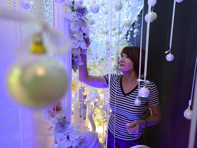 Julia Wray works on Boyes' Christmas windows.