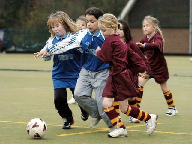 Do you recognise anyone from this Gladstone Road A (blue.white kit) v Lisvane B game at this 2004 Scarborough Primary Schools girls football tournament, held at Scarborough College.