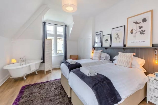 This second floor bedroom is currently furnished with twin beds.