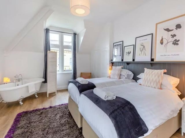 This second floor bedroom is currently furnished with twin beds.