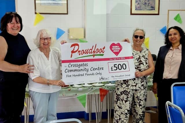 Proudfoot director Valerie Aston (left) presents a cheque to Crossgates Community Centre