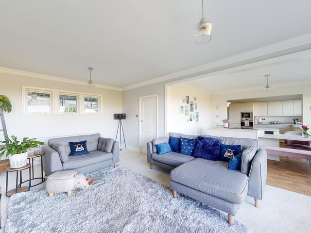 The lounge and entertainment space links to the kitchen.