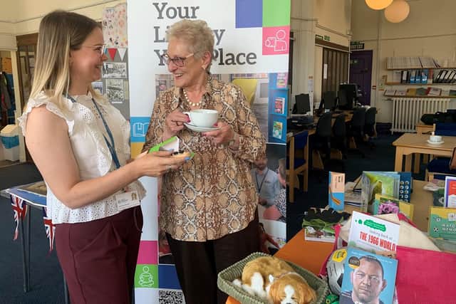 Area librarian Catherine Barlow (left), and library visitor Enid Cheetham.