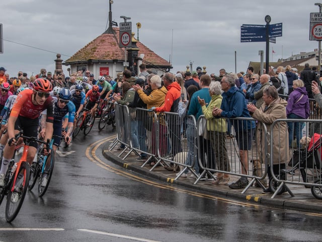 Applause for the cyclists as they go over Whitby Swing Bridge.