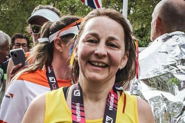 A smiling Mel at the finish line