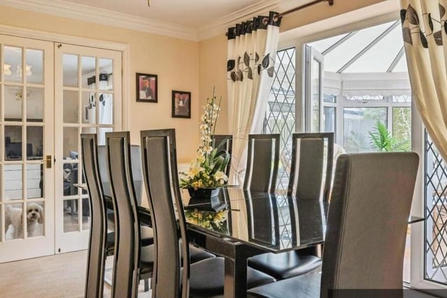 The dining room opens through to the conservatory.