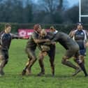 Hosts Malton & Norton and Scarborough battle it out in the mud, Jake Lyon being tackled by Malton.