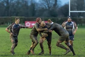 Hosts Malton & Norton and Scarborough battle it out in the mud, Jake Lyon being tackled by Malton.