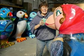 Skipsea-based artist Saffron Waghorn working on repairs to puffin sculpture ‘Headscarf Revolutionary’ by Susan Woolhouse.