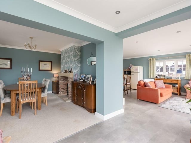 The dual aspect multi-fuel stove is a feature in the dining room, that also has patio doors leading outside