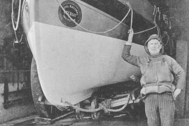 An old postcard view of George Webster (Coxswain 1910 - 1915) next to the James Gowland