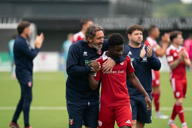 Boro boss Jono Greening hugs two-goal hero Mo Fadera after the 5-1 home win against Southport. Photo by Wandering Photography