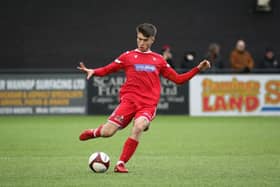 Scarborough Athletic's Kian Spence delivers a dangerous cross into Bamber Bridge's box.