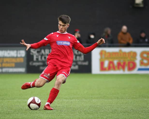 Scarborough Athletic's Kian Spence delivers a dangerous cross into Bamber Bridge's box.