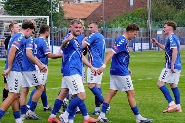 Whitby skipper Stu Rose leads the celebrations after he puts Town 2-0 ahead in the first half. Photo by Owen Cox