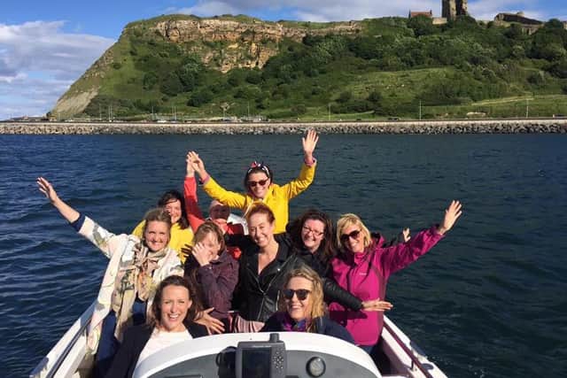 Passengers enjoying a high speed powerboat experience on Scarborough's beautiful coastline