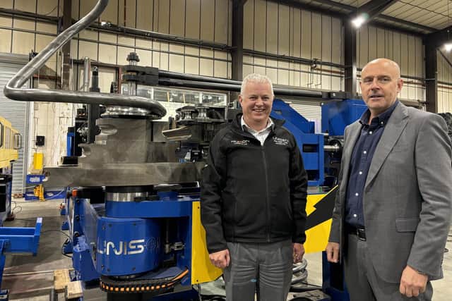 Unison Ltd’s joint managing directors, Alan Pickering and Julian Kidger, alongside an all-electric Unison Breeze 80 mm multi-stack tube bending machine.