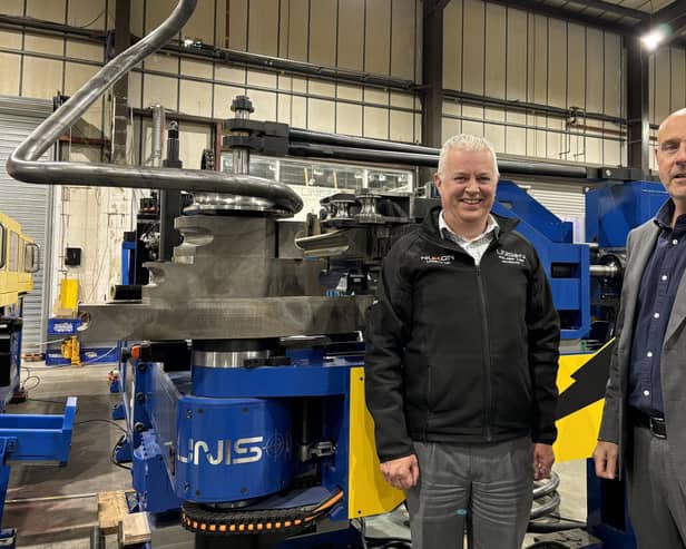 Unison Ltd’s joint managing directors, Alan Pickering and Julian Kidger, alongside an all-electric Unison Breeze 80 mm multi-stack tube bending machine.