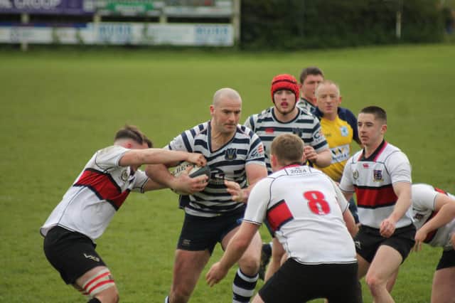 Captain Joe Holbrough blasts through for the second of his three tries for Pocklington RUFC. PHOTO BY PHIL GILBANK