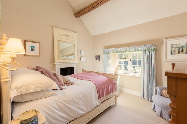 One of the beamed bedrooms within the cottage.