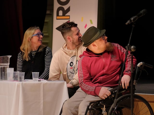 The panel enjoy the poems.