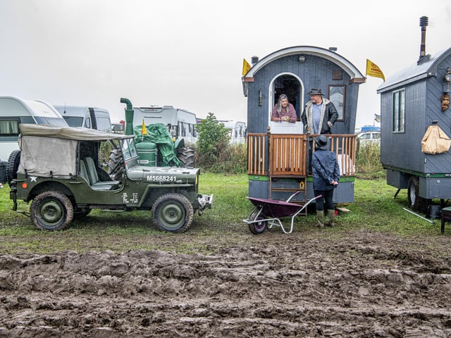 A vintage Land Rover and caravans