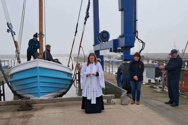 Rev Miriam Thurlow of Bridlington Christ Church gives a blessing before Three Brothers is lowered into the harbour. Photograph courtesy of Ian Coultas.