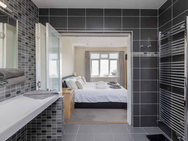 Looking from the en suite facility to a double bedroom within the property.