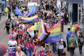 The colourful parade makes its way through the town