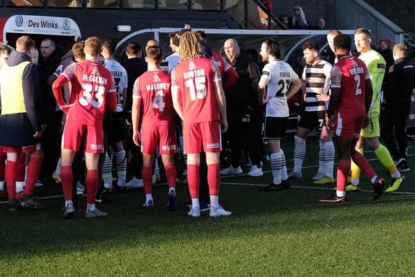 Scarborough Athletic and Darlington players leave the field during the clash on January 2.