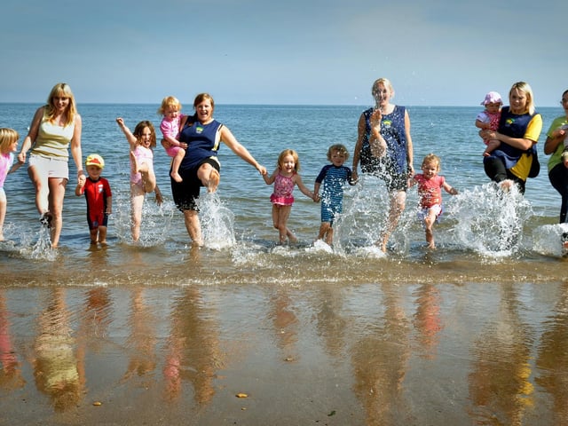 Children and staff from Buttercups Nursery take to the beach on the last day of the school holidays.